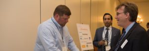 LAIPLA members and corporate sponsors talking at sponsor display table