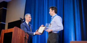 USPTO's Andrei Iancu presents an award at LAIPLA's Washington in the West, 2020