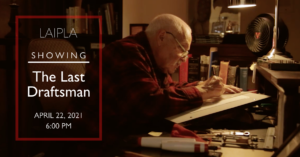 Photo of aged man sitting at drafting desk
