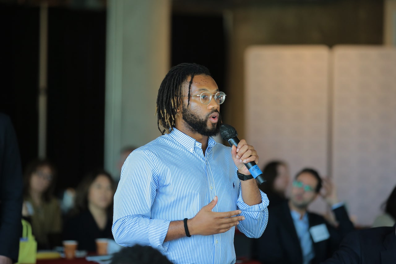 An attendee asks a question during a Q&A session at TechTainment 8.0, November 2022